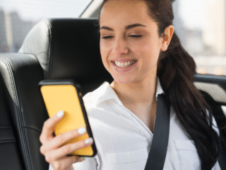 passenger-using-her-mobile-phone-car-1